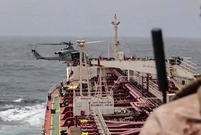 Tanker explodes after hitting landmine in Strait of Hormuz as tensions rise between US and Iran