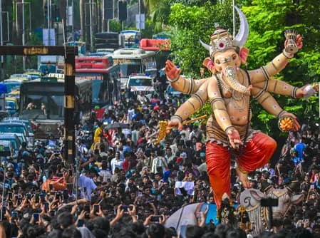 Tragic accident involving a falling Ganesh idol in South Mumbai; two dead.
