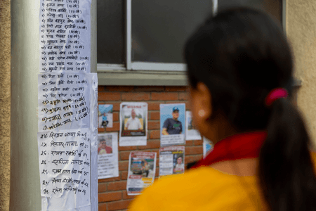 Families put up posters outside Kathmandu hospital in hope of finding their loved ones